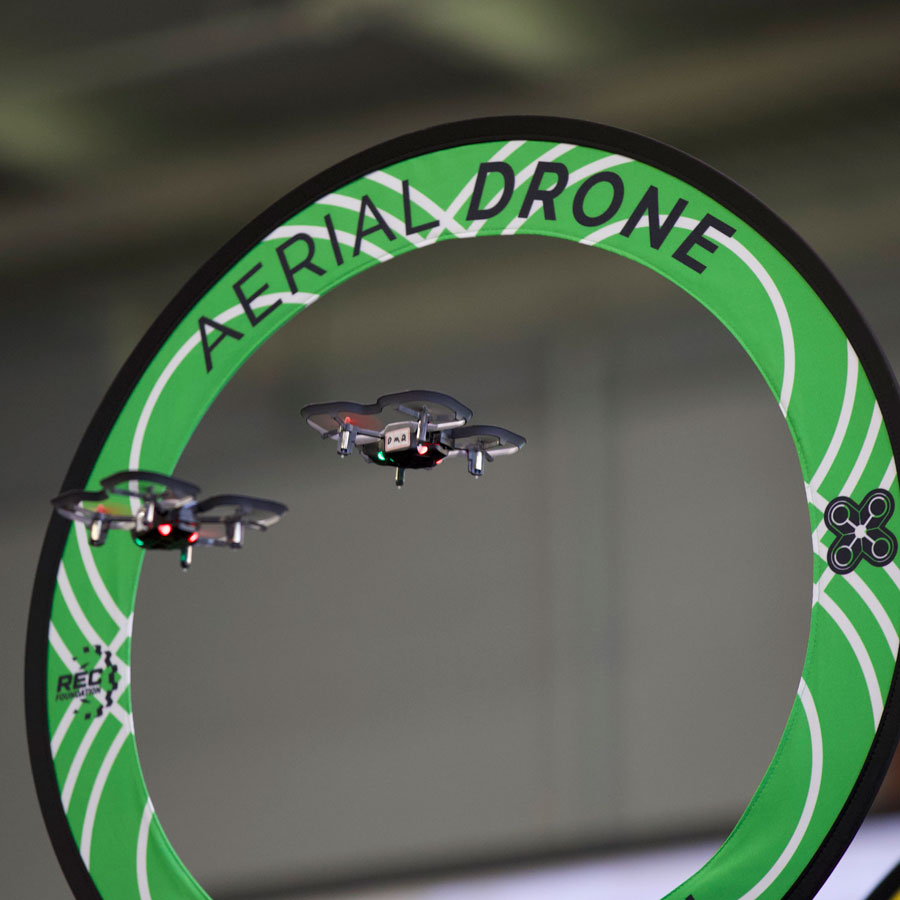 Drones fly through a game element