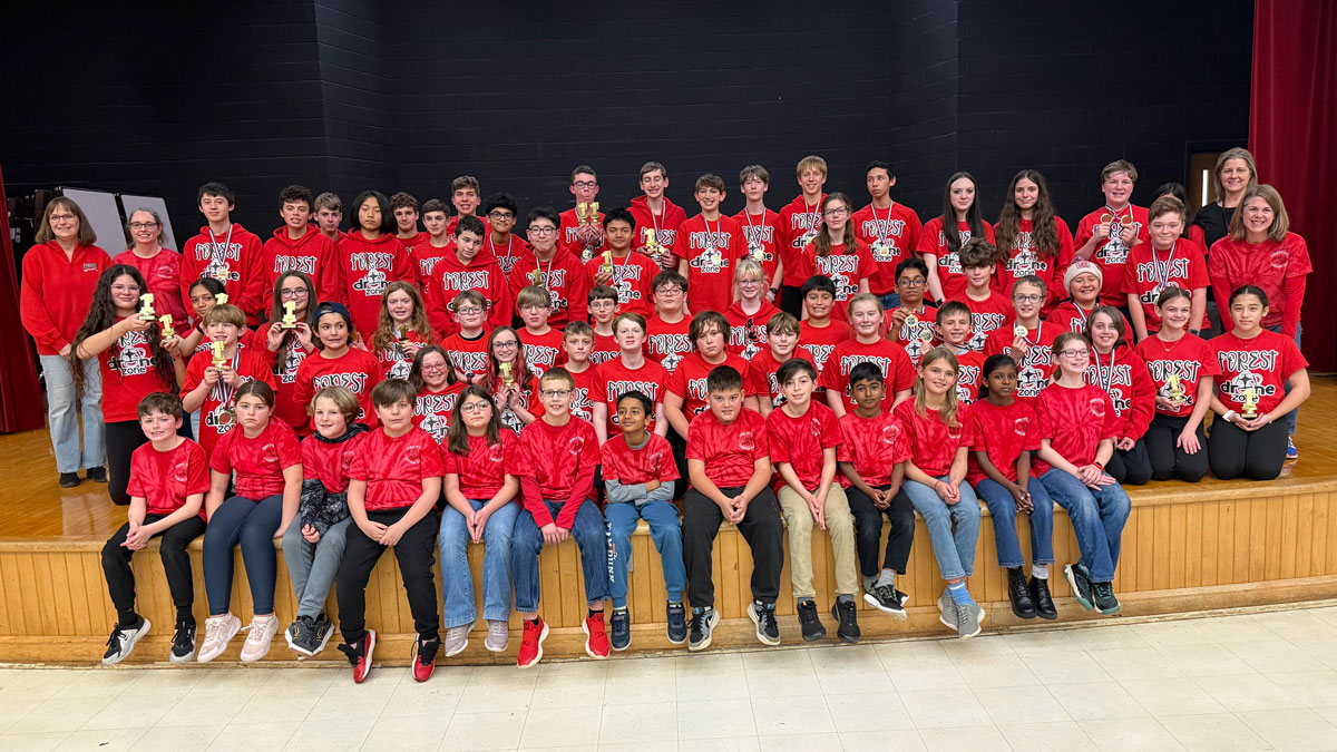 Cindy Watson with her robotics team