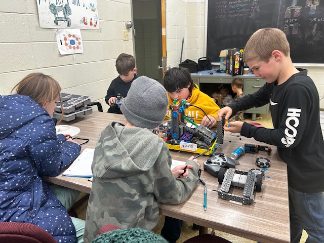Robotics team works on their robot